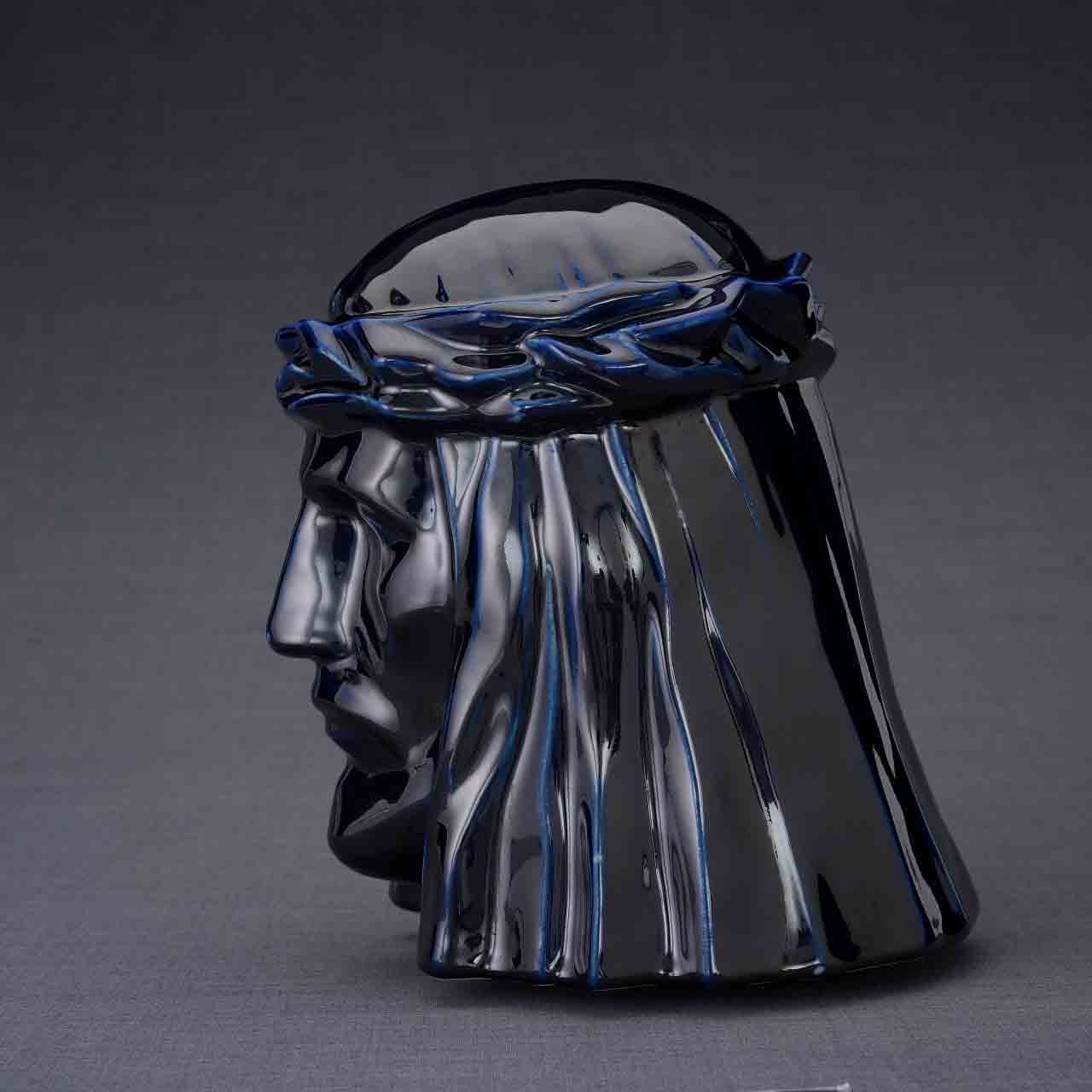 The Christ Cremation Urn for Ashes in Metallic Blue Facing Left Dark Background