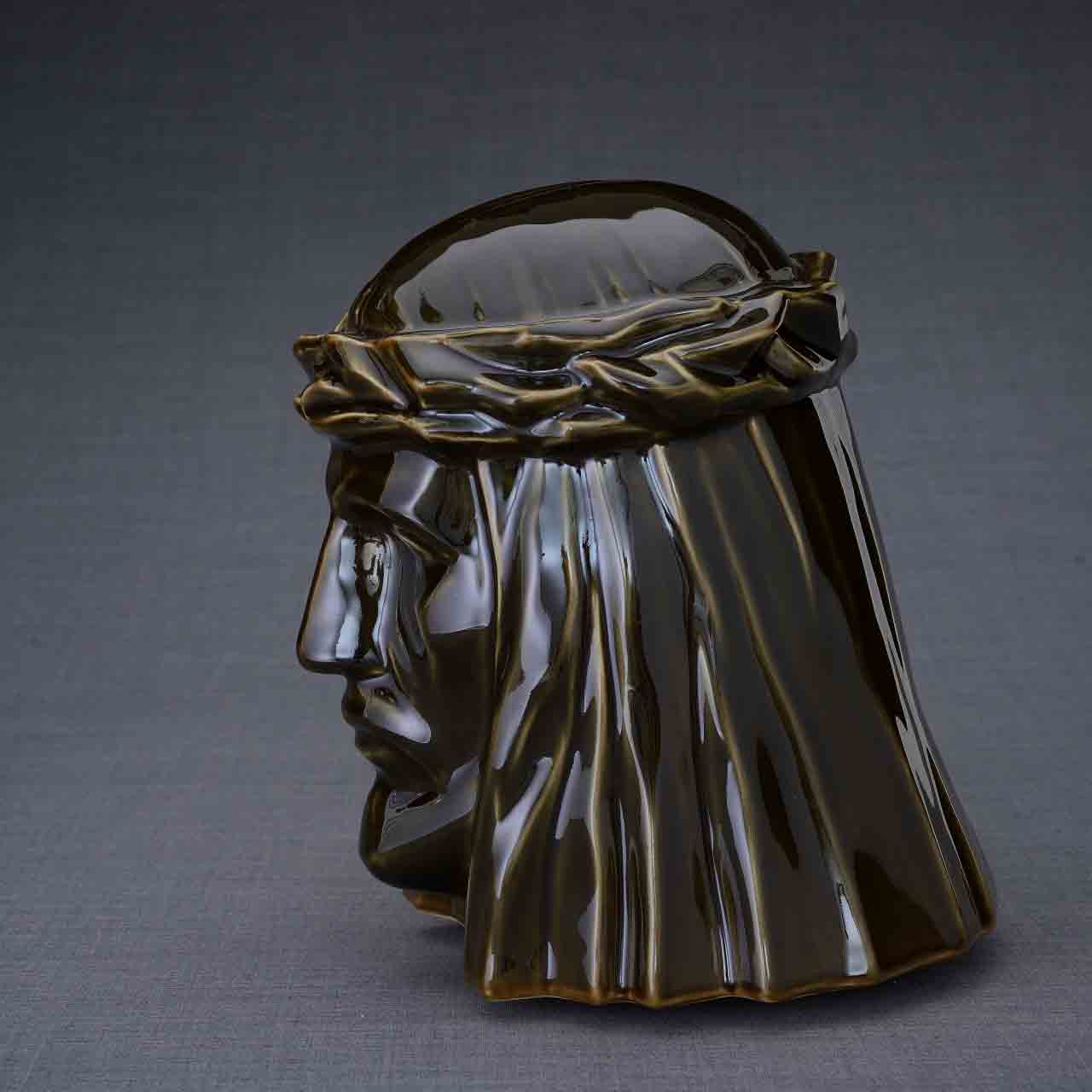 The Christ Cremation Urn for Ashes in Oily Brown Facing Left Dark Background