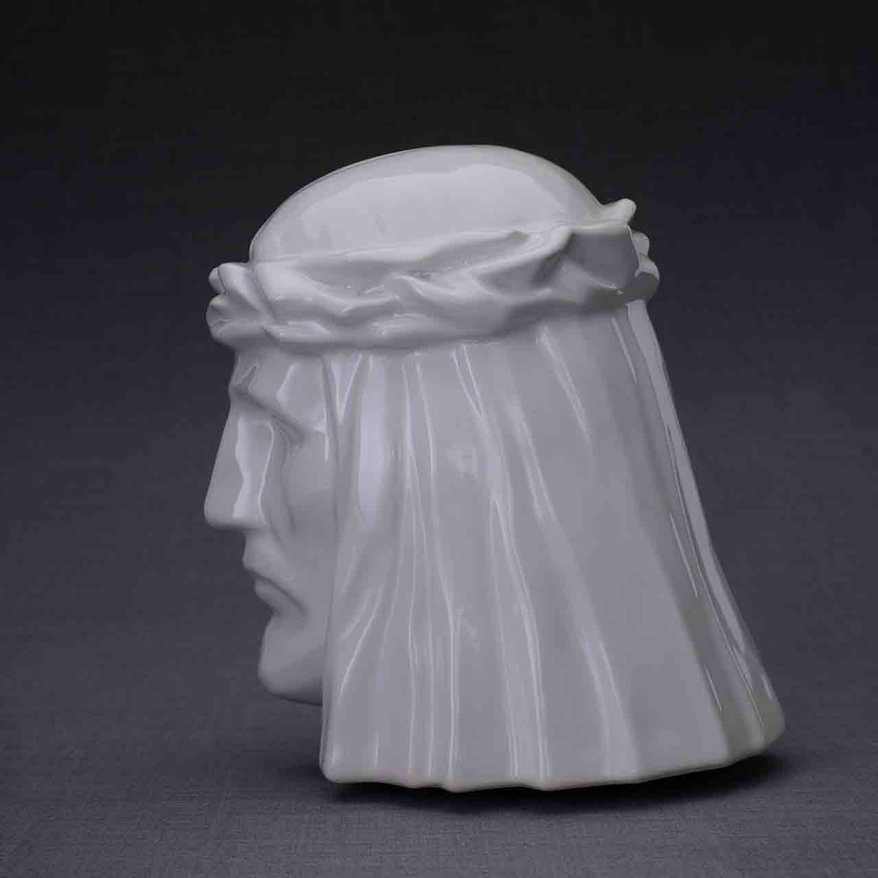 The Christ Cremation Urn for Ashes in White Facing Left Dark Background