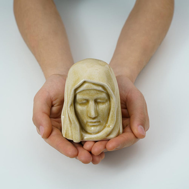 The Holy Mother Ashes Keepsake Urn Light Sand in Hands