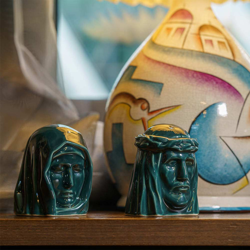 The Holy Mother Ashes Keepsake Urn with The Christ Ashes Keepsake Green by Lamp