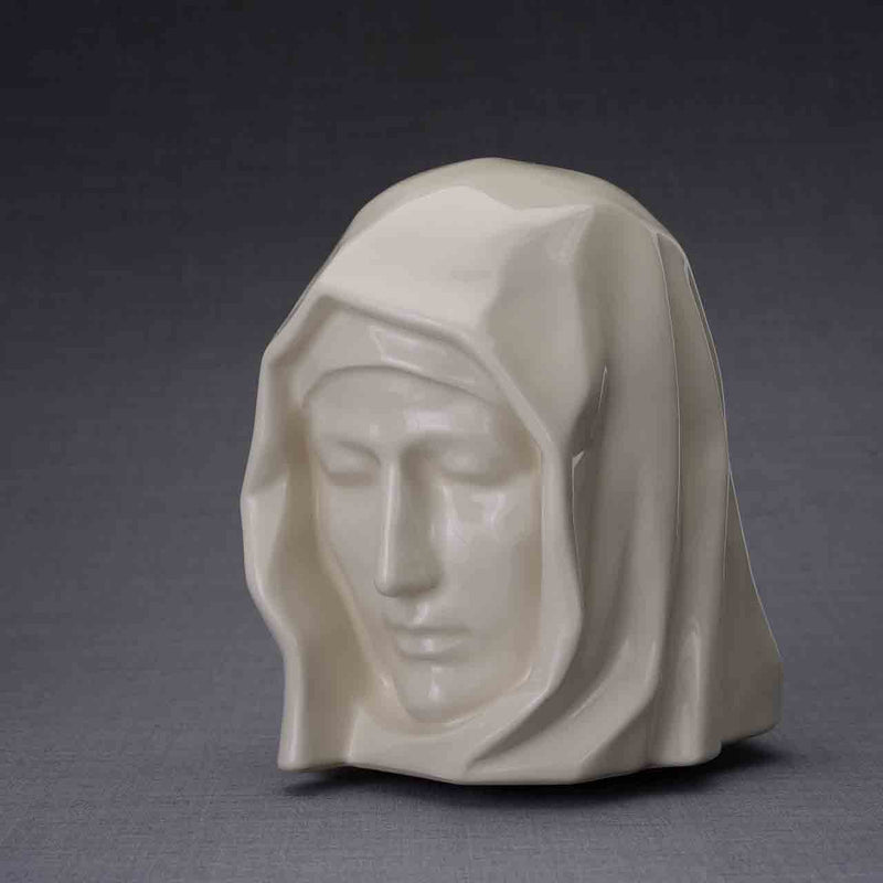 The Holy Mother Cremation Urn for Ashes in Cream Turned Left Dark Background