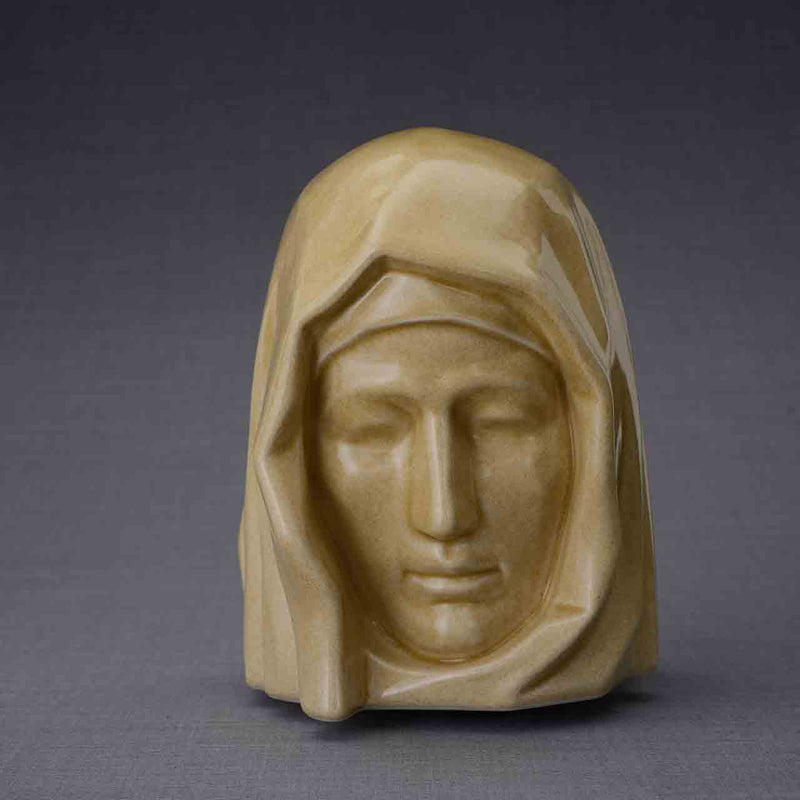 The Holy Mother Cremation Urn for Ashes in Light Sand Dark Background