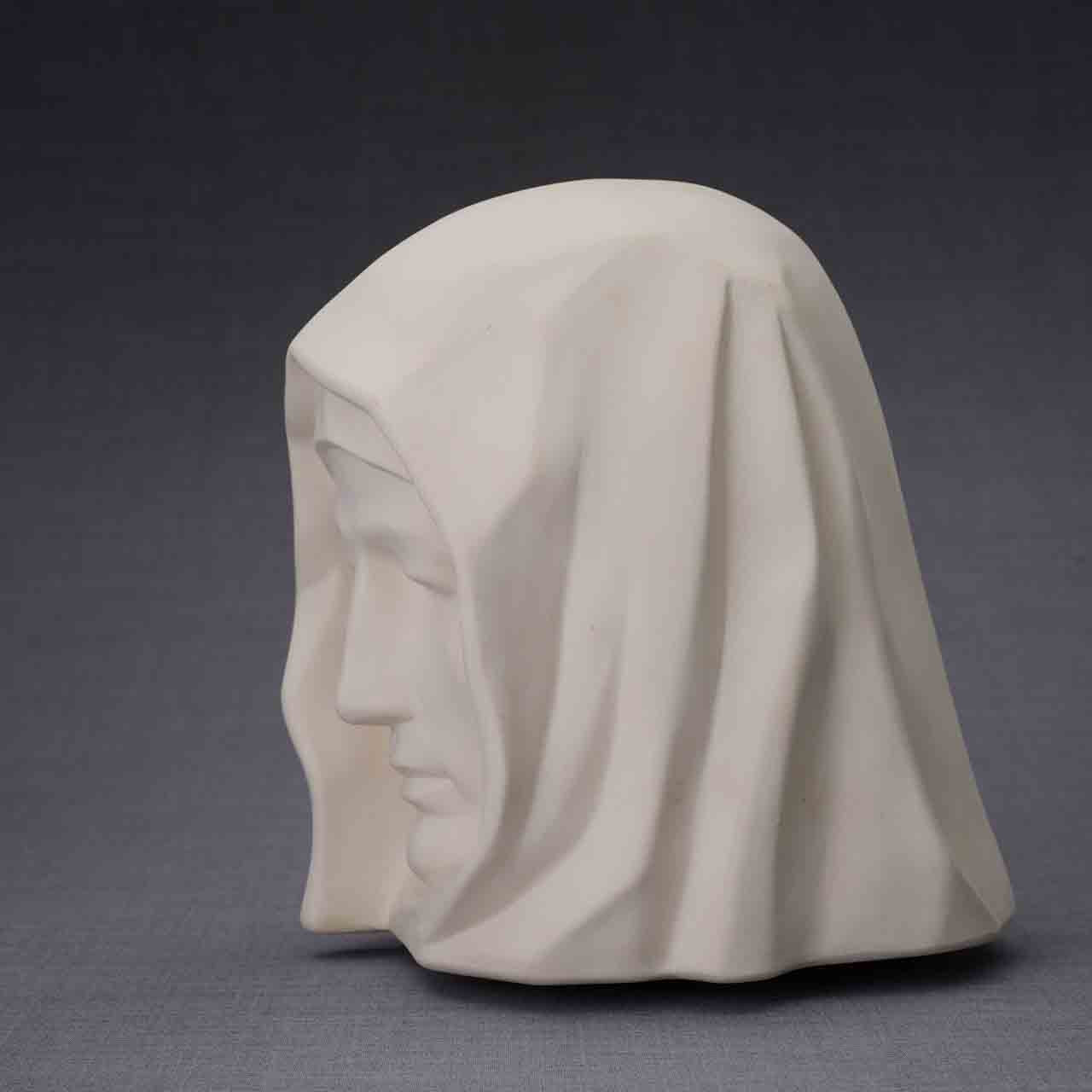 The Holy Mother Cremation Urn for Ashes in Matte White Facing Left Dark Background