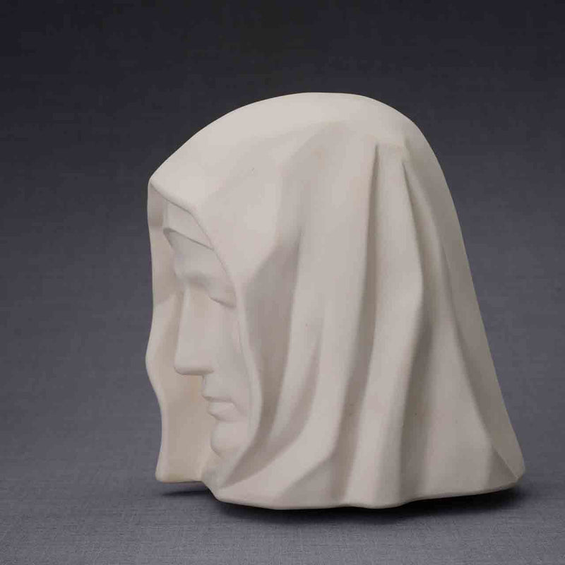 The Holy Mother Cremation Urn for Ashes in Matte White Facing Left Dark Background