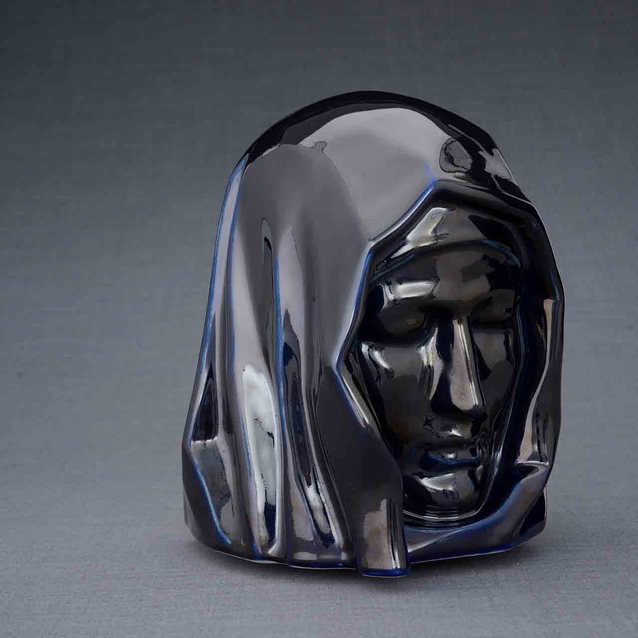 The Holy Mother Cremation Urn for Ashes in Metallic Blue Turned Right Dark Background