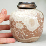 Urtite Ashes Keepsake Urn Close up with Hand