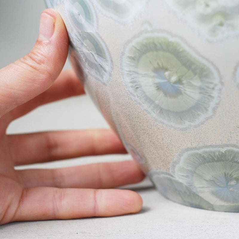 White Calcite Cremation Urn for Ashes - Adult Close up with Hand