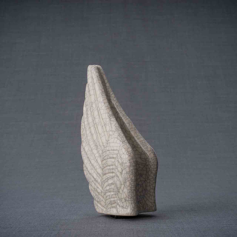 Angel Wings Ashes Keepsake Urn in Crackle Glaze Turned Left Dark Background