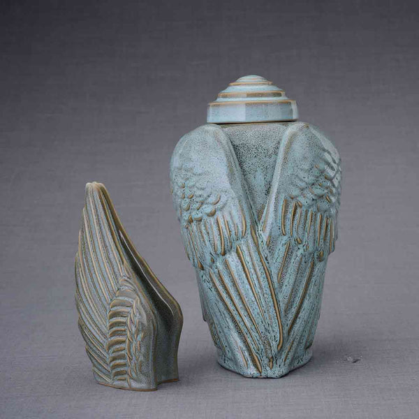 Angel Wings Cremation Urn and Ashes Keepsake Urn in Oily Green Dark Background
