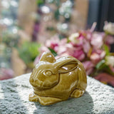 Rabbit Urn For Ashes Amber On Cushion Front Left