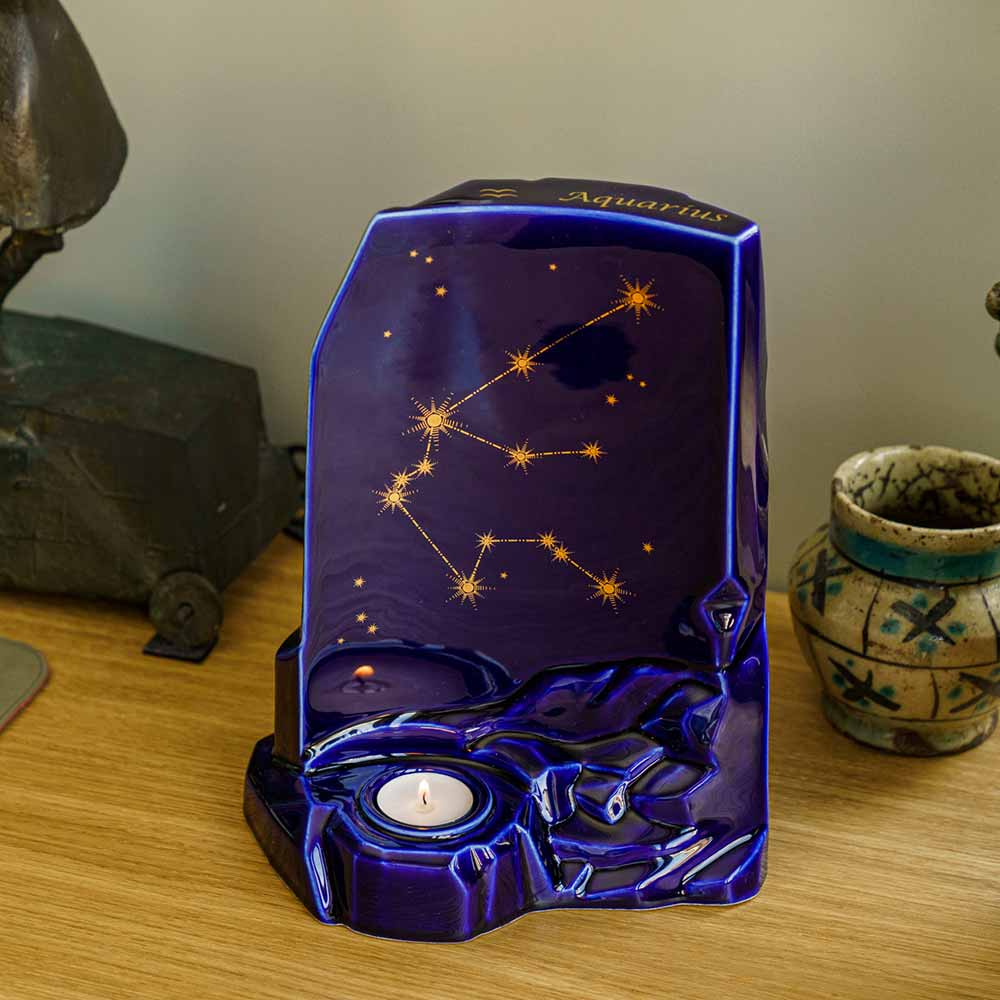 zodiac star sign adult cremation urn for ashes range aquarius on desk facing left